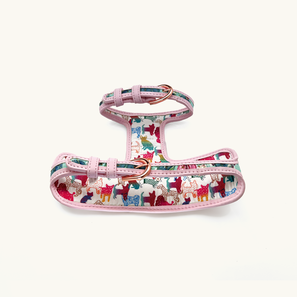 Reverse of Hummingbird dog harness with colorful dog pattern and gold buckles
