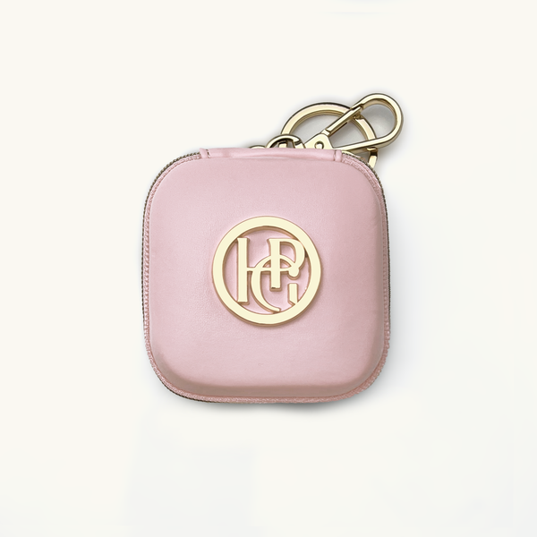 Baby pink dog waste/treat bag with gold logo and keychain