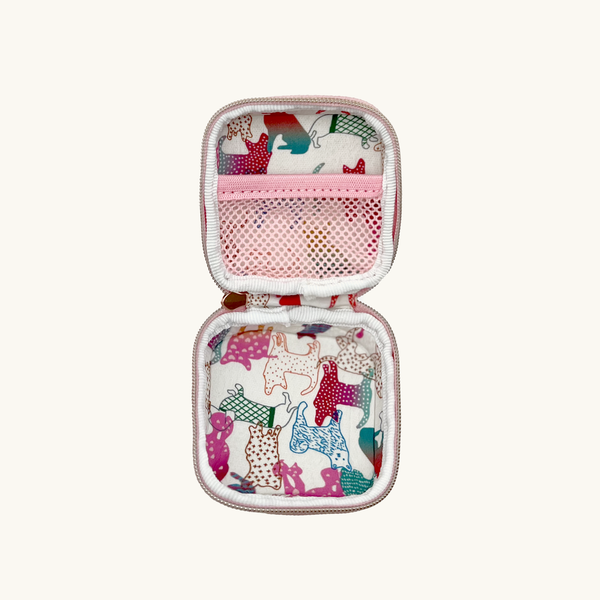 Baby pink dog waste/treat bag opened with animal pattern on a white background