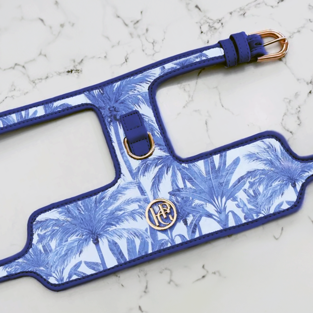 Palms Blue palm leaf patterned dog harness on a marble surface