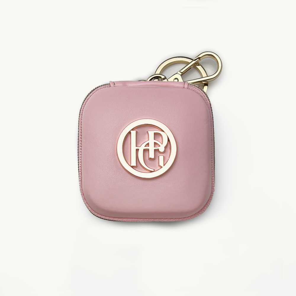 Light pink waste/treat bag with gold hardware